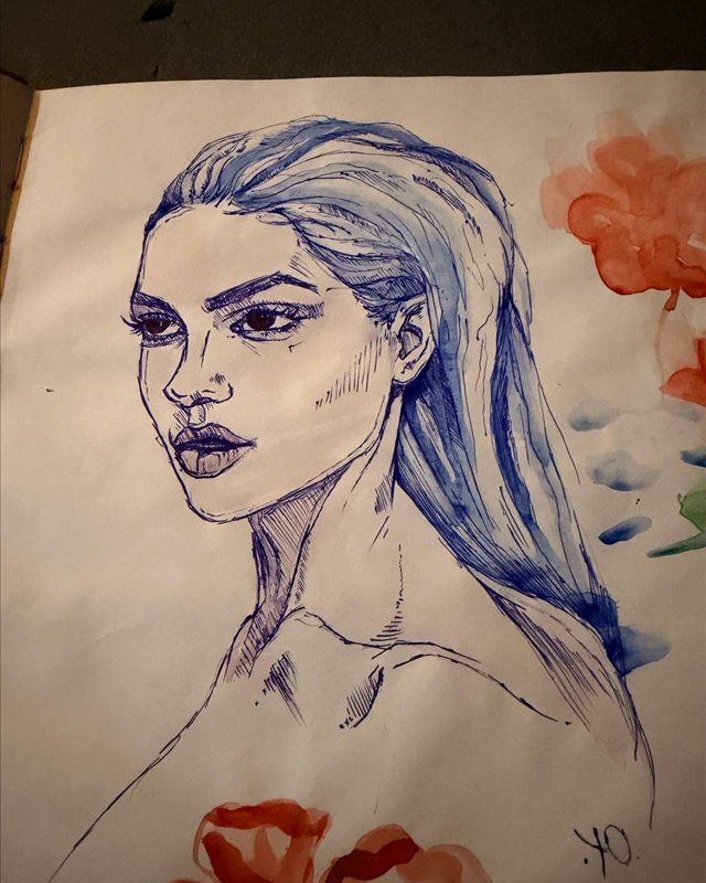 Blue ink portrait of a woman with long hair and red watercolour flowers