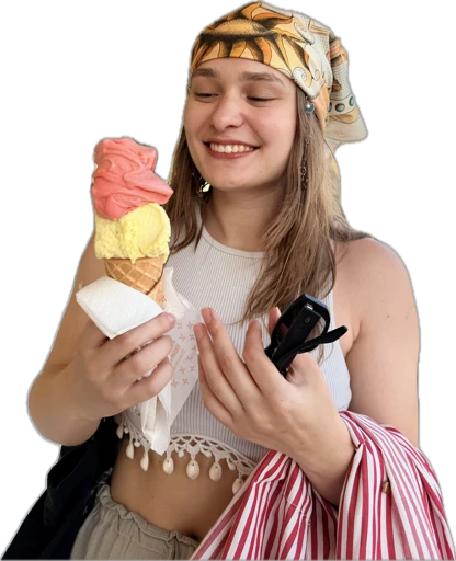 Yuliia smiling and holding a pink and yellow ice cream cone